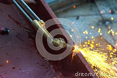 Metal Cutting With Acetylene Gas. Workman is working by use torch Stock Photo