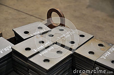 Metal cutting. Sorting and storage of finished parts with marking Stock Photo