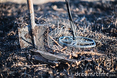 Metal detector, spade, and finding rusty metal. Recreation. Hobby. Stock Photo