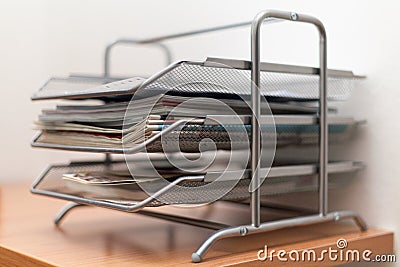 Metal drawers briefcases with newspapers and magazines on wooden Stock Photo