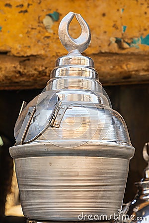 Metal drink urns for sale at an outdoor market Stock Photo