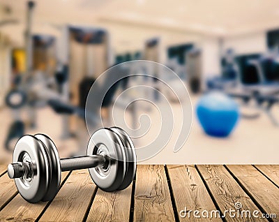 Metal dumbbell with gym background Stock Photo