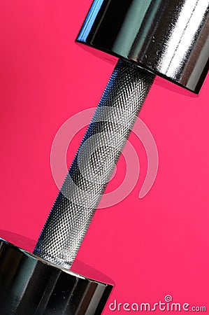 Metal Dumbbell on Pink Background Stock Photo