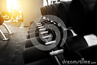 Metal dumbbells lying on gym fitness club Stock Photo