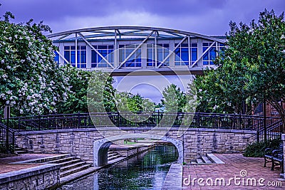 Metal enclosed walkway bridge in Big Spring International Park Huntsville, Alabama Stock Photo
