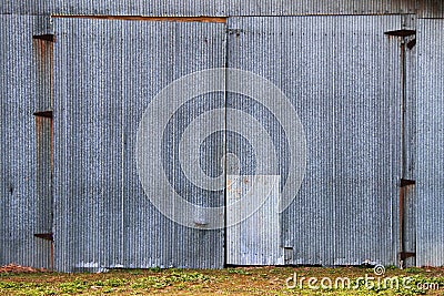 metal farming storage steel iron door farm barn rusty doors loading dock factory warehouse entrance Stock Photo