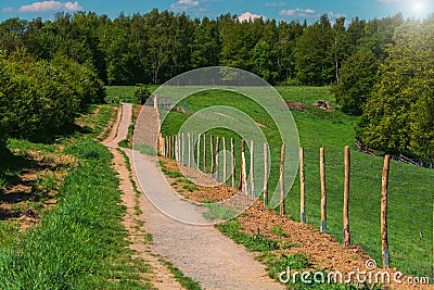 Metal fence on a hiking trail Stock Photo