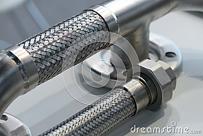 Metal flexible tube, adapter, connecting nut. Plumbing equipment Stock Photo