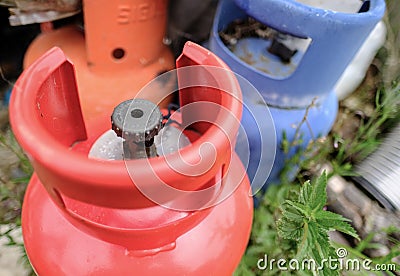 Gas bottles seen outside a factory having been used for heating. Stock Photo