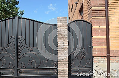 Metal gate and fence entrance door Stock Photo