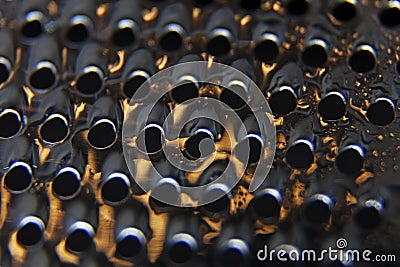 Metal grater close up with water drops Stock Photo