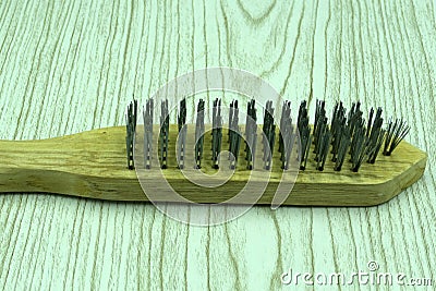 Metal grill brush closeup metallic scraper brush . Stock Photo