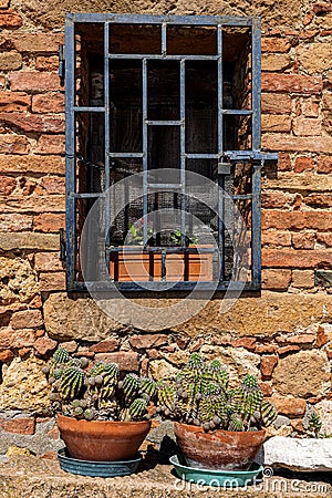 Metal-grilled window Stock Photo