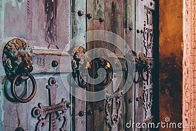 Metal handles with lion`s head, large door of the Amalfi cathedral Stock Photo