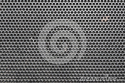 Metal honeycomb grilled pattern in front of music speaker as background Stock Photo