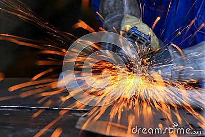 Metal industry worker grinding Stock Photo