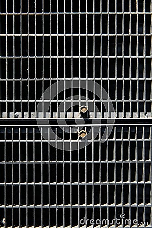 Metal lattice with small cells grid stock background with shallow Stock Photo