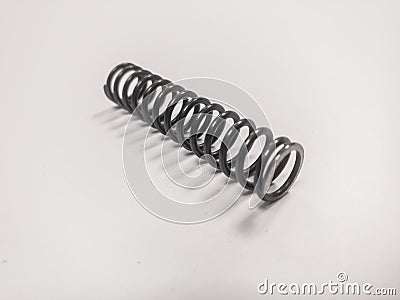 Metal mainspring on a white background Stock Photo