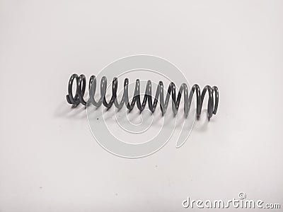 Metal mainspring on a white background Stock Photo