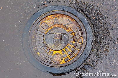Metal manhole cover with the inscription 