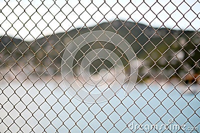 Metal mesh wire fence Stock Photo