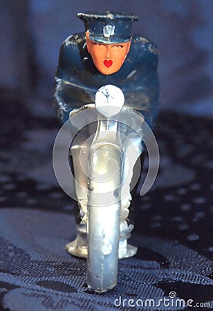 Metal Motorcycle Cop with Lipstick Heart Shaped Lips Toy Stock Photo