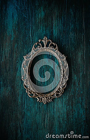 Metal oval frame on a wall Stock Photo