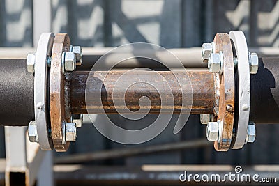 Metal pipe with flanges. Connection of pipe with flanges and welding Stock Photo