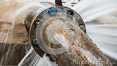 Metal pipe with valve is leaking in water treatment plant Stock Photo