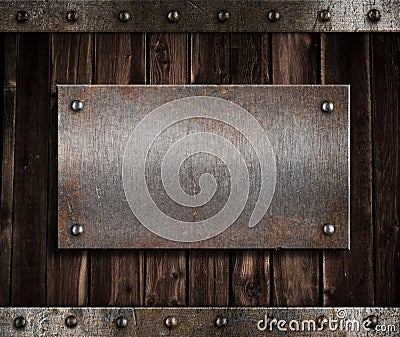 Metal plate on old wooden wall Stock Photo