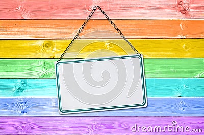 Metal plate sign hanging on a pastel colorful rainbow painted wood Stock Photo