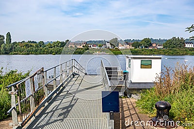 Metal platform at small ferry dock on Maas river Stock Photo