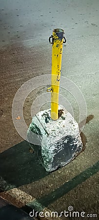 A metal pole as a boundary marker Stock Photo