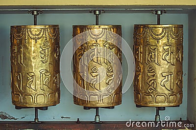 Metal prayer wheels with mantras in Dharamsala Stock Photo