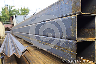 Metal profile pipe of rectangular cross section in packs at the warehouse of metal products Stock Photo