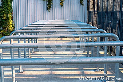 Metal railings in front of gates of Silesian Stadium in ChorzÃ³w, Poland. Row of steel rails. Stock Photo
