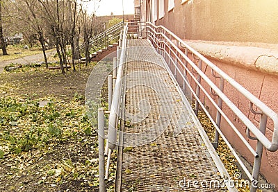 Metal ramp for movement and barrier-free access for wheelchairs, outdoor Stock Photo