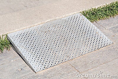 Metal ramp for supporting disabled people wheelchair. Stock Photo