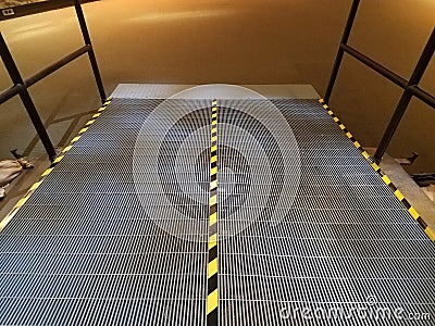 Metal ramp with yellow and black stripes Stock Photo