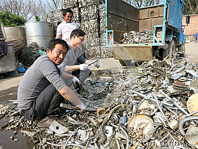 Metal Recycling - People Working in Recycling Center Editorial Stock Photo