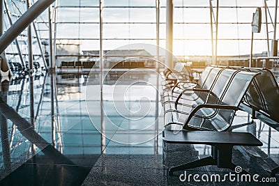 Metal row of seats in airport terminal Stock Photo