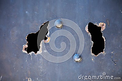 Metal with rusty hole and flaking paint Stock Photo