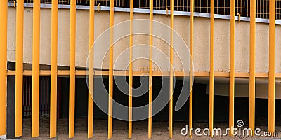 Metal scaffolds of yellow colour cover white balcony Stock Photo