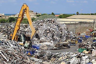 Metal scrap and crane grabber Stock Photo