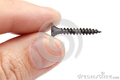 Metal self-tapping in the hand, on white background. Stock Photo