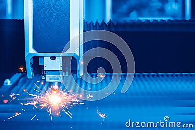 Metal Sheet Laser Cutting Machine closeup nozzle head for modern industrial technology blue color Stock Photo