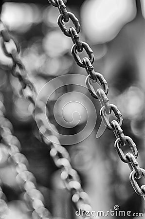 Metal shiny chain links stylized black and white film Stock Photo