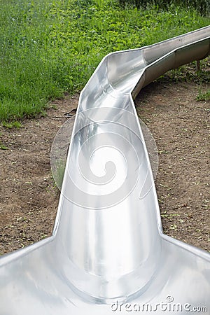 Metal slide toboggan grass Stock Photo