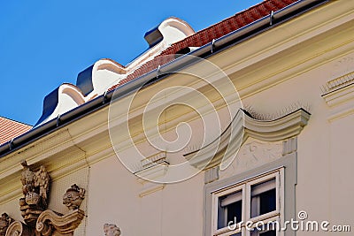 metal spike anti-roosting, bird prevention and repellent strips over vintage wood windows. Stock Photo