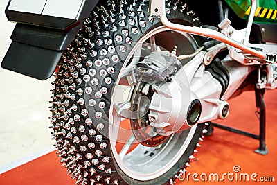 Metal spikes on motorcycle wheel Stock Photo